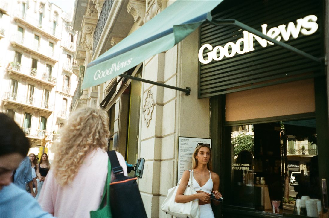 Filming on a city street corner outside the Good News storefront